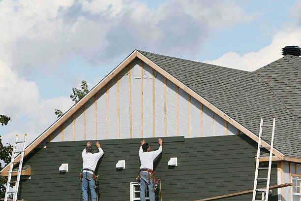 Professional Siding technician working in Surry, VA